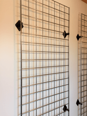 We recommend at least 4 wall brackets to hold 1 grid panel to the wall